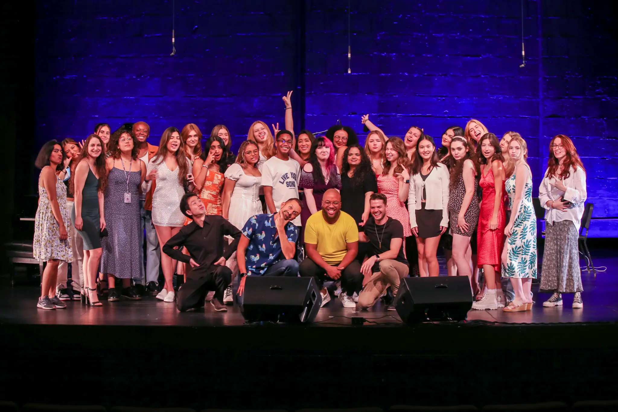 Jamon Maple with large group of students on stage